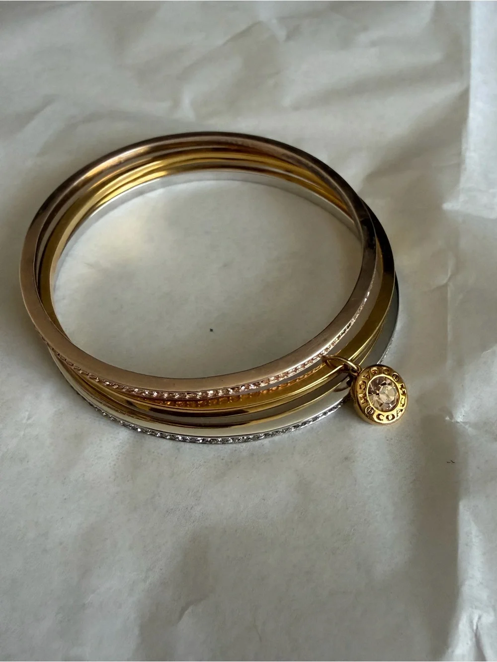 Coach Two-Tone Gold and Silver Stacked Bangle Set with Charm